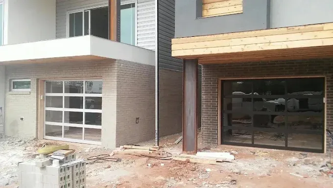 Modern full-view glass garage doors on new home installed by Affordable Door Co OKC