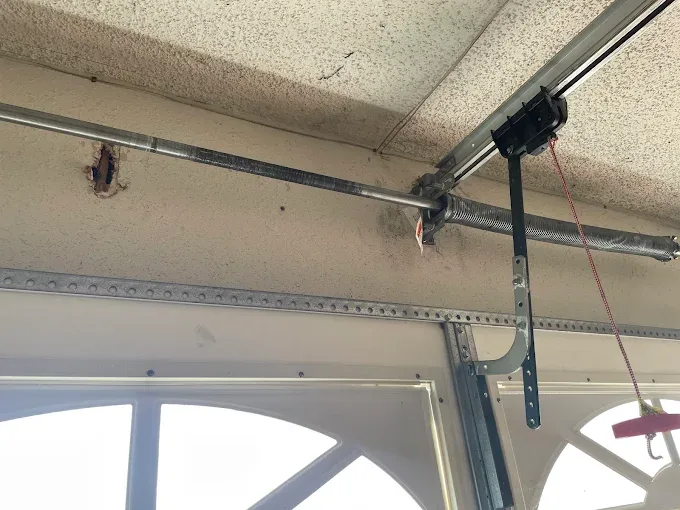 Garage door torsion spring and hardware repair by Affordable Door Co Oklahoma City OK
